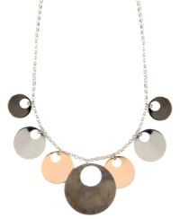 Out of this world. Striking cut-out circles create a unique orbital design on Nine West's shaky necklace. Set in silver, rose gold, and hematite-plated mixed metal. Approximate length: 17 inches + 2-inch extender. Approximate drop: 1-1/2 inches. Out of this world. Striking cut-out circles create a unique orbital design on Nine West's shaky necklace. Set in silver, rose gold, and hematite-plated mixed metal. Approximate length: 17 inches + 2-inch extender. Approximate drop: 1-1/2 inches.