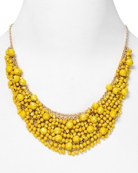 Brighten up every outfit with this layered beaded bib necklace from Cara accented by a dramatic collar of yellow stones. Brighten up every outfit with this layered beaded bib necklace from Cara accented by a dramatic collar of yellow stones.