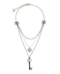 Sweet layers of femininity for the blossoming fashionista. Another innovative design by Betsey Johnson - necklace features ribbon accents with a sparkling strand of crystal, a crystal coated heart charm, and a black-plated crystal key. Necklace crafted in antique silver tone mixed metal. Approximate length: 16 inches + 3-inch extender. Approximate drop: 1-3 inches. Sweet layers of femininity for the blossoming fashionista. Another innovative design by Betsey Johnson - necklace features ribbon accents with a sparkling strand of crystal, a crystal coated heart charm, and a black-plated crystal key. Necklace crafted in antique silver tone mixed metal. Approximate length: 16 inches + 3-inch extender. Approximate drop: 1-3 inches.