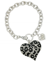 GUESS shows it has its heart in the right place with this bracelet. Crafted from silver-tone mixed metal with glass crystal stones and jet accents. Approximate length: 7-1/2 inches. Approximate drop: 1-1/2 inches. Approximate GUESS shows it has its heart in the right place with this bracelet. Crafted from silver-tone mixed metal with glass crystal stones and jet accents. Approximate length: 7-1/2 inches. Approximate drop: 1-1/2 inches. Approximate