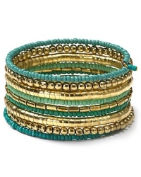 Nail this season's eclectic jewelry trend with beaded coil bracelet from Aqua. Decorated with layers of multi colored beads this colorful piece will work just as well for day as for night. Nail this season's eclectic jewelry trend with beaded coil bracelet from Aqua. Decorated with layers of multi colored beads this colorful piece will work just as well for day as for night.