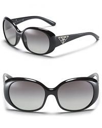 Glam it up in Prada's round sunglasses with signature triangle logo at temples. Glam it up in Prada's round sunglasses with signature triangle logo at temples.