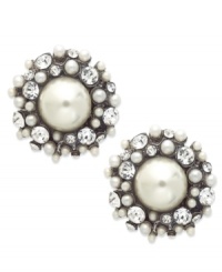 A pair of stud earrings from Bar III bursting with intrigue. Imitation pearls are surrounded by shimmering crystal accents. Crafted in gold tone mixed metal. Approximate diameter: 1 inch. A pair of stud earrings from Bar III bursting with intrigue. Imitation pearls are surrounded by shimmering crystal accents. Crafted in gold tone mixed metal. Approximate diameter: 1 inch.
