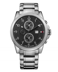 Vintage appeal from a modern name. Tommy Hilfiger watch crafted of stainless steel bracelet and round case. Black dial with three subdials, iconic flag logo and date window at three o'clock, silver tone Arabic numerals, stick indices, minute track and black three hands. Quartz movement. Water resistant to 30 meters. Ten-year limited warranty. Vintage appeal from a modern name. Tommy Hilfiger watch crafted of stainless steel bracelet and round case. Black dial with three subdials, iconic flag logo and date window at three o'clock, silver tone Arabic numerals, stick indices, minute track and black three hands. Quartz movement. Water resistant to 30 meters. Ten-year limited warranty.