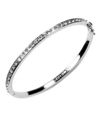 Polished and sleek. Givenchy's rhodium-plated silver tone bracelet features crystal glass stone detailing. Approximate diameter: 2-1/2 inches. Polished and sleek. Givenchy's rhodium-plated silver tone bracelet features crystal glass stone detailing. Approximate diameter: 2-1/2 inches.