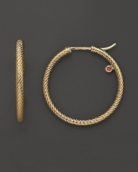 Circle rope hoop earrings in yellow gold; with signature ruby accent. Designed by Roberto Coin. Circle rope hoop earrings in yellow gold; with signature ruby accent. Designed by Roberto Coin.