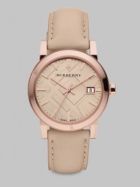 An iconic check stamped dial with a warm rose goldtone stainless steel case and a supple leather strap. Swiss quartz movementWater resistant to 5 ATMRound rose goldtone stainless steel case, 34mm (1.3)Smooth bezelNude check stamped dialBar hour markersDate display at 3 o'clockSecond hand Nude leather strapMade in Switzerland An iconic check stamped dial with a warm rose goldtone stainless steel case and a supple leather strap. Swiss quartz movementWater resistant to 5 ATMRound rose goldtone stainless steel case, 34mm (1.3)Smooth bezelNude check stamped dialBar hour markersDate display at 3 o'clockSecond hand Nude leather strapMade in Switzerland