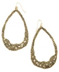 Organic inspiration. A subtle asymmetrical design makes RACHEL Rachel Roy's trendy hoop earrings a total must-have. Crafted in gold tone mixed metal with sparkling crystal accents. Approximate drop: 3-1/4 inches. Organic inspiration. A subtle asymmetrical design makes RACHEL Rachel Roy's trendy hoop earrings a total must-have. Crafted in gold tone mixed metal with sparkling crystal accents. Approximate drop: 3-1/4 inches.
