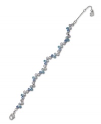 An attractive array of pale blue and clear crystals complement one another on Swarovski's finely crafted bezel bracelet. Set in silver tone mixed metal. Approximate length: 6-1/2 inches. An attractive array of pale blue and clear crystals complement one another on Swarovski's finely crafted bezel bracelet. Set in silver tone mixed metal. Approximate length: 6-1/2 inches.