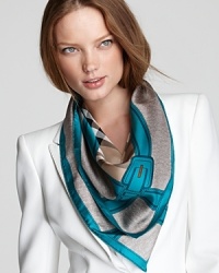 A classic camel check print and teal buckle-printed border accent this luxurious square scarf from Burberry. A classic camel check print and teal buckle-printed border accent this luxurious square scarf from Burberry.