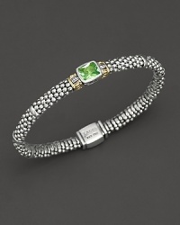 From the Glacier collection, thin caviar rope bracelet with centered peridot stone and gold accents. Designed by Lagos. From the Glacier collection, thin caviar rope bracelet with centered peridot stone and gold accents. Designed by Lagos.