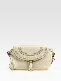 Metallic leather, crafted in a sleek flap silhouette with a versatile crossbody strap.Removable adjustable strap, 21¼-22½ dropFlap snap closureOne inside open pocketCanvas lining9¼W X 6H X 3DMade in Spain Metallic leather, crafted in a sleek flap silhouette with a versatile crossbody strap.Removable adjustable strap, 21¼-22½ dropFlap snap closureOne inside open pocketCanvas lining9¼W X 6H X 3DMade in Spain