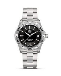 The Aquaracer series features professional diving watches with TAG Heuer's Six Features: Screw in crown, unidirectional rotating bezel, sapphire crystal, double security clasp, 300M water resistance and luminescent hands and markers. This model features black dial and steel case and bracelet. The Aquaracer series features professional diving watches with TAG Heuer's Six Features: Screw in crown, unidirectional rotating bezel, sapphire crystal, double security clasp, 300M water resistance and luminescent hands and markers. This model features black dial and steel case and bracelet.