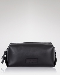 A sophisticated travel companion, this handsome dopp kit is crafted in soft Italian leather. A sophisticated travel companion, this handsome dopp kit is crafted in soft Italian leather.
