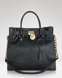 Clean and simply detailed, this versatile MICHAEL Michael Kors tote flaunts effortless style on-duty or off. Clean and simply detailed, this versatile MICHAEL Michael Kors tote flaunts effortless style on-duty or off.
