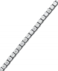 Match point. A seamless row of round-cut diamonds (6 ct. t.w.) epitomize perfection in this stunning tennis bracelet. Crafted in 14k white gold. Approximate length: 7-1/4 inches. Match point. A seamless row of round-cut diamonds (6 ct. t.w.) epitomize perfection in this stunning tennis bracelet. Crafted in 14k white gold. Approximate length: 7-1/4 inches.