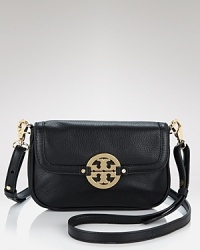 A bright gold tone logo gleams on this petite leather bag, featuring a removable crossbody strap. By Tory Burch. A bright gold tone logo gleams on this petite leather bag, featuring a removable crossbody strap. By Tory Burch.