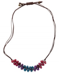 Grace your neck with colorful folksiness. The multicolored dyed jade beads on this Fossil necklace are placed on a chocolate-colored waxed cord with brass tone mixed metal floral charms. Adjustable sliding closure. Approximate length: 16 inches to 26 inches.