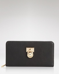 The Hamilton wallet captures the cosmopolitan essence of MICHAEL Michael Kors with its padlock design and sophisticated colored leather. The Hamilton wallet captures the cosmopolitan essence of MICHAEL Michael Kors with its padlock design and sophisticated colored leather.