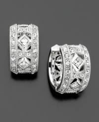 Beautiful huggie earrings with gleaming crystal accents convey timeless elegance. Rhodium plated. Diameter measures 1/2 inch. Beautiful huggie earrings with gleaming crystal accents convey timeless elegance. Rhodium plated. Diameter measures 1/2 inch.