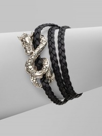 From the Naga Collection. A braid of rich leather wraps the wrist three times while weaving in and out of a curvaceous silver dragon.LeatherSterling silverLength, about 6½Lobster claspMade in Bali From the Naga Collection. A braid of rich leather wraps the wrist three times while weaving in and out of a curvaceous silver dragon.LeatherSterling silverLength, about 6½Lobster claspMade in Bali