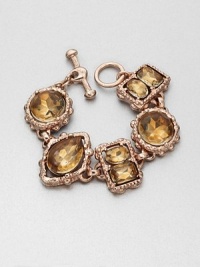 Beautiful faceted stones in an organically-shaped setting. GlassHand-crafted resinPewter and brassLength, about 7.5Toggle closureMade in USA Beautiful faceted stones in an organically-shaped setting. GlassHand-crafted resinPewter and brassLength, about 7.5Toggle closureMade in USA
