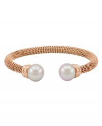 Lovely and luxurious. Crafted in rich rose gold tone stainless steel, Majorica's beautiful bangle bracelet is enhanced by organic man-made pearls. Wear it anytime you want to add extra elegance to your look. Approximate diameter: 2-1/2 inches. Lovely and luxurious. Crafted in rich rose gold tone stainless steel, Majorica's beautiful bangle bracelet is enhanced by organic man-made pearls. Wear it anytime you want to add extra elegance to your look. Approximate diameter: 2-1/2 inches.