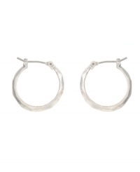 Chic hoops are essentials for your collection. Kenneth Cole New York earrings feature small-sized click hoops in silver tone mixed metal. Approximate diameter: 3/4 inch. Chic hoops are essentials for your collection. Kenneth Cole New York earrings feature small-sized click hoops in silver tone mixed metal. Approximate diameter: 3/4 inch.