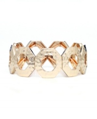 Slip shapely style over your wrist for a look of effortless elegance. Nine West's chic interlocking circles bracelet features a stretch design in gold tone mixed metal. Approximate diameter: 2-1/4 inches. Slip shapely style over your wrist for a look of effortless elegance. Nine West's chic interlocking circles bracelet features a stretch design in gold tone mixed metal. Approximate diameter: 2-1/4 inches.