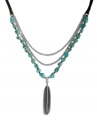 Light as a feather, heavy fashion. Lucky Brand's chic frontal necklace features a three-row design combining semi-precious reconstituted turquoise stones, silver tone mixed metal chains and a detailed feather charm. Draped on a nylon cord. Approximate length: 36 inches. Approximate drop: 3-3/4 inches. Light as a feather, heavy fashion. Lucky Brand's chic frontal necklace features a three-row design combining semi-precious reconstituted turquoise stones, silver tone mixed metal chains and a detailed feather charm. Draped on a nylon cord. Approximate length: 36 inches. Approximate drop: 3-3/4 inches.