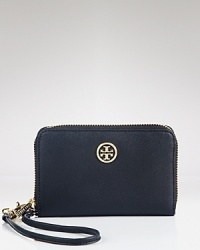 Stylish functionality, a leather Tory Burch wristlet is designed with the iPhone in mind, trimmed by an understated logo medallion. Stylish functionality, a leather Tory Burch wristlet is designed with the iPhone in mind, trimmed by an understated logo medallion.