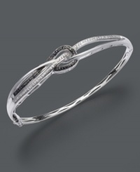 Tie up all the loose ends with this complementary black and white bangle. Chic knot design by Wrapped in Love™ features round-cut black diamonds (1/8 ct. t.w) and sparkling white diamond accents in a sterling silver setting. Approximate diameter: 2-1/2 inches. Tie up all the loose ends with this complementary black and white bangle. Chic knot design by Wrapped in Love™ features round-cut black diamonds (1/8 ct. t.w) and sparkling white diamond accents in a sterling silver setting. Approximate diameter: 2-1/2 inches.
