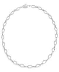 Shape up with a little shimmer. Eliot Danori's intricate oval link necklace glistens with the addition of round-cut crystals. Set in silver tone mixed metal. Approximate length: 16 inches. Shape up with a little shimmer. Eliot Danori's intricate oval link necklace glistens with the addition of round-cut crystals. Set in silver tone mixed metal. Approximate length: 16 inches.