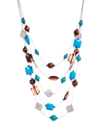 Funky, chunky and fun. Playful shapes and bright colors adorn Haskell's vibrant illusion necklace. Five delicate rows are adorned with faceted acrylic turquoise and wooden beads, mixed with silver-plated mixed metal setting and accent beads. Approximate length: 18 inches + 3-inch extender. Approximate drop: 4-1/2 inches. Funky, chunky and fun. Playful shapes and bright colors adorn Haskell's vibrant illusion necklace. Five delicate rows are adorned with faceted acrylic turquoise and wooden beads, mixed with silver-plated mixed metal setting and accent beads. Approximate length: 18 inches + 3-inch extender. Approximate drop: 4-1/2 inches.