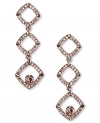 Triple play. These drop earrings from Givenchy sparkle with vintage rose stones and a triple drop silhouette. Crafted in brown gold tone mixed metal. Approximate drop: 2-1/8 inches. Triple play. These drop earrings from Givenchy sparkle with vintage rose stones and a triple drop silhouette. Crafted in brown gold tone mixed metal. Approximate drop: 2-1/8 inches.