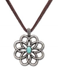 Worn long or wrapped up short, this Lucky Brand necklace adds the perfect amount of rugged charm to any look. Flower pendant carved in worn silver tone mixed metal with semi-precious reconstituted calcite turquoise stone at center of petals. Suspended from brown cord. Approximate length: 34 inches. Approximate drop: 2 inches. Worn long or wrapped up short, this Lucky Brand necklace adds the perfect amount of rugged charm to any look. Flower pendant carved in worn silver tone mixed metal with semi-precious reconstituted calcite turquoise stone at center of petals. Suspended from brown cord. Approximate length: 34 inches. Approximate drop: 2 inches.