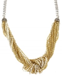'Tis the season to twinkle! Jessica Simpson's chic knotted necklace combines multiple strands of acrylic beads in shimmery gold and silver hues. Set in silver tone mixed metal. Approximate length: 17 inches. 'Tis the season to twinkle! Jessica Simpson's chic knotted necklace combines multiple strands of acrylic beads in shimmery gold and silver hues. Set in silver tone mixed metal. Approximate length: 17 inches.