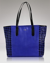 Punch up your accessories portfolio. This roomy leather tote bag from Cole Haan, with it's woven detailing, is a playful yet practical way to do it. Punch up your accessories portfolio. This roomy leather tote bag from Cole Haan, with it's woven detailing, is a playful yet practical way to do it.