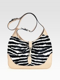 Lush zebra-striped haircalf pairs with rich leather in a roomy carryall.Adjustable and detachable shoulder strap, 8¾-19¾ dropPiston clasp closureOne inside zip pocketOne cell phone pocketOne PDA pocketLinen lining13W X 8¾H X 2¾DMade in Italy of imported fabric Lush zebra-striped haircalf pairs with rich leather in a roomy carryall.Adjustable and detachable shoulder strap, 8¾-19¾ dropPiston clasp closureOne inside zip pocketOne cell phone pocketOne PDA pocketLinen lining13W X 8¾H X 2¾DMade in Italy of imported fabric