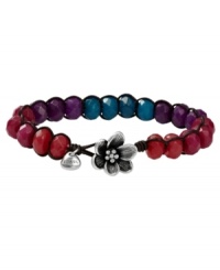 Pick some berries this season. Fossil's beaded bracelet features a chic, chocolate brown leather cord decorated with dyed faceted jade beads. Crafted in silver tone mixed metal with a sculpted flower at closure. Approximate length: 8 inches. Pick some berries this season. Fossil's beaded bracelet features a chic, chocolate brown leather cord decorated with dyed faceted jade beads. Crafted in silver tone mixed metal with a sculpted flower at closure. Approximate length: 8 inches.