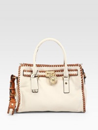 Structured, supple leather style embellished with allover whipstitched leather trim and a signature goldtone logo charm.Double top handles, 4¾ dropAdjustable shoulder strap, 12-13 dropTop snap closureProtective metal feetOne inside zip pocketOne inside key hookFour inside open pocketsCotton lining14¼W X 13H X 5½DImported Structured, supple leather style embellished with allover whipstitched leather trim and a signature goldtone logo charm.Double top handles, 4¾ dropAdjustable shoulder strap, 12-13 dropTop snap closureProtective metal feetOne inside zip pocketOne inside key hookFour inside open pocketsCotton lining14¼W X 13H X 5½DImported