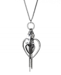Attract an audience with charming style. GUESS necklace features a double heart pendant, a crystal fireball charm, and chic chain and crystal accents. Crafted in hematite tone mixed metal. Approximate length: 28 inches + 2-inch extender. Approximate drop: 2-1/2 inches. Attract an audience with charming style. GUESS necklace features a double heart pendant, a crystal fireball charm, and chic chain and crystal accents. Crafted in hematite tone mixed metal. Approximate length: 28 inches + 2-inch extender. Approximate drop: 2-1/2 inches.