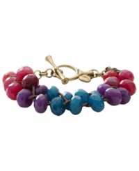Vibrant hues add a fresh touch to your look. This toggle bracelet from Fossil features a waxed chocolate cord decorated with color-dyed jade beads. Crafted in brass tone mixed metal. Toggle and bar closure. Approximate diameter: 7-1/2 inches. Vibrant hues add a fresh touch to your look. This toggle bracelet from Fossil features a waxed chocolate cord decorated with color-dyed jade beads. Crafted in brass tone mixed metal. Toggle and bar closure. Approximate diameter: 7-1/2 inches.