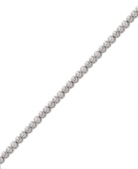 Add sheer elegance to your ensemble with a simple, sparkling bracelet. Swarovski's tennis-style bracelet features bezel-set round-cut crystals in silver tone mixed metal. Approximate length: 7 inches. Add sheer elegance to your ensemble with a simple, sparkling bracelet. Swarovski's tennis-style bracelet features bezel-set round-cut crystals in silver tone mixed metal. Approximate length: 7 inches.