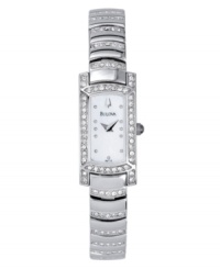 A sparkling take on a glamorous, vintage style. Features mother of pearl dial, curved crystal-accented bracelet and crystal bezel. Water resistant up to 30 meters. Three-year limited warranty. A sparkling take on a glamorous, vintage style. Features mother of pearl dial, curved crystal-accented bracelet and crystal bezel. Water resistant up to 30 meters. Three-year limited warranty.