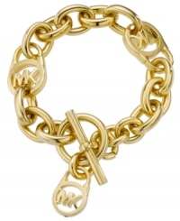 Add a touch of designer to your style. Michael Kors MK logo lock bracelet features a gold tone mixed metal setting with a trendy toggle clasp. Approximate length: 8 inches. Add a touch of designer to your style. Michael Kors MK logo lock bracelet features a gold tone mixed metal setting with a trendy toggle clasp. Approximate length: 8 inches.