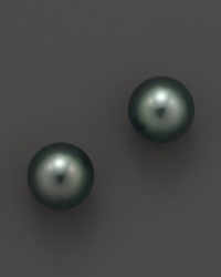 Naturally colored, cultured Tahitian black pearls make a statement on delicate stud earrings. From Tara Pearls. Naturally colored, cultured Tahitian black pearls make a statement on delicate stud earrings. From Tara Pearls.