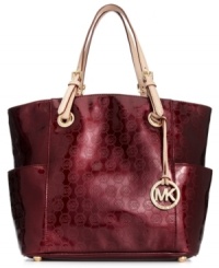 Shoulder this city-chic design from MICHAEL Michael Kors and add signature style to your work or weekend wardrobe. Supple patent leather is outfitted with shiny golden hardware and iconic MK monogram pattern, while the pocket-lined interior easily meets all your daily demands. Shoulder this city-chic design from MICHAEL Michael Kors and add signature style to your work or weekend wardrobe. Supple patent leather is outfitted with shiny golden hardware and iconic MK monogram pattern, while the pocket-lined interior easily meets all your daily demands.