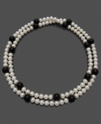 This lovely string of luminous cultured freshwater pearls (7-8 mm) offset by the dark beauty of onyx (7-8 mm) goes with anything, for any occasion. Approximate length: 36 inches. This lovely string of luminous cultured freshwater pearls (7-8 mm) offset by the dark beauty of onyx (7-8 mm) goes with anything, for any occasion. Approximate length: 36 inches.