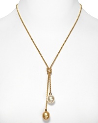 A delicate gold necklace with Lariat knot and double man-made pearl pendant. Designed by Majorica. A delicate gold necklace with Lariat knot and double man-made pearl pendant. Designed by Majorica.